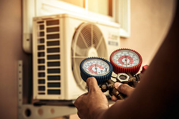Professional Air Conditioning Service technician working in Dania, FL